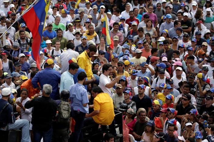 Lawmaker Freddy Guevara (C) addresses demonstrators during a rally against Venezuela