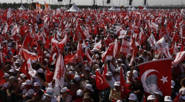 People wave Turkish flags during a rally to mark the end of the main opposition Republican People