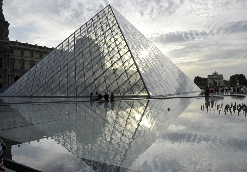 epa07434423 (FILE) The Louvre Pyramid reflects the sunlight in the late afternoon outside the Musee du Louvre, in Paris, France, 11 September 2010 (reissued 13 March 2019). Built by US-Chinese architect Ieoh Ming Pei, the Louvre Pyramid celebrates the 30th anniversary of its inauguration, dated 30 March 1989. EPA/HORACIO VILLALOBOS *** Local Caption *** 02330530