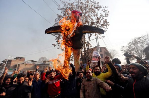 Demonstrators burn an effigy depicting U.S. President Donald Trump during a protest against the U.S. decision to recognize Jerusalem as the capital of Israel, in Srinagar. REUTERS/Danish Ismail