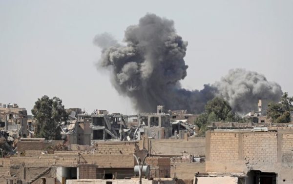Smoke rises at the positions of the Islamic State militants after an air strike by the coalition forces at the frontline. REUTERS/Erik De Castro