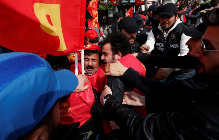 Plainclothes police officers detain a protester as he and others attempted to defy a ban and march on Taksim Square to celebrate May Day, in Istanbul, Turkey, May 1, 2017.  REUTERS/Murad Sezer